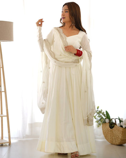 Divine Off White Colored Heavy Roman Silk Chanderi Anarkali Gown